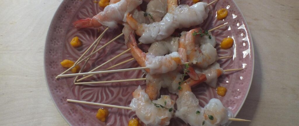 Code di gambero con lardo di cinta senese e salsa alle carote